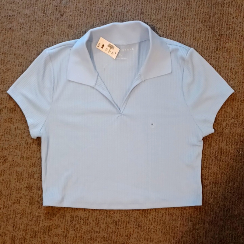 Cropped t-shirt, v-neck, collared. Ribbed texture. Never worn, still has tags